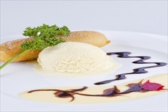 Banana fritter served with vanilla ice cream